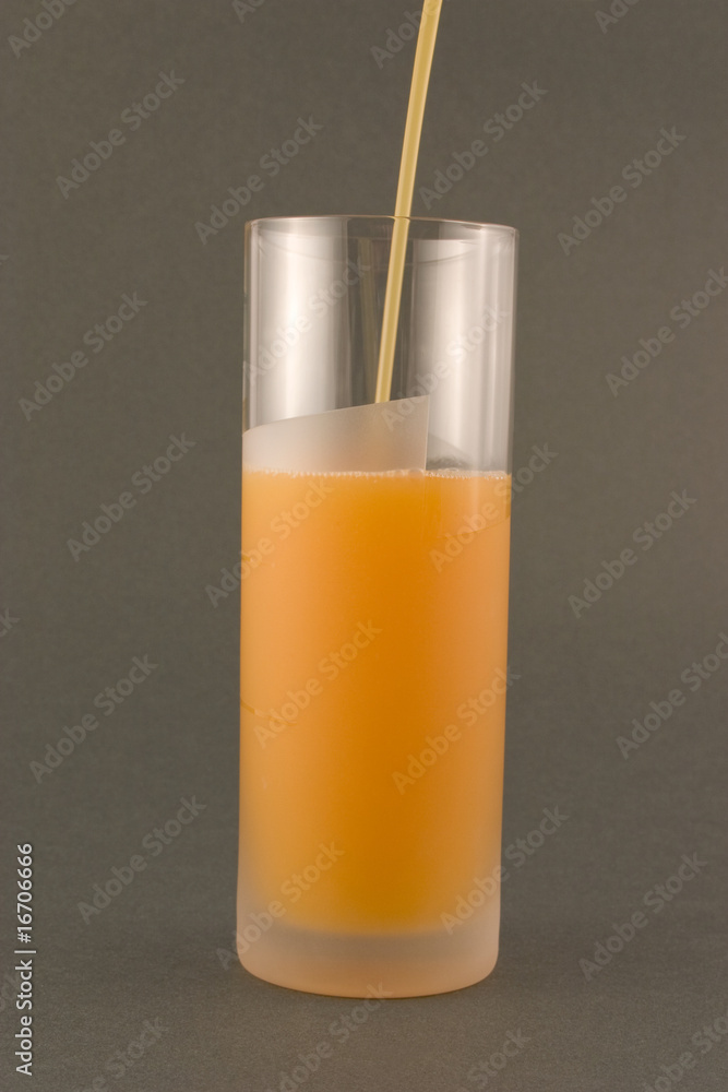 orange juice pored in glass on the dark background orange juice pored in glass on the dark background