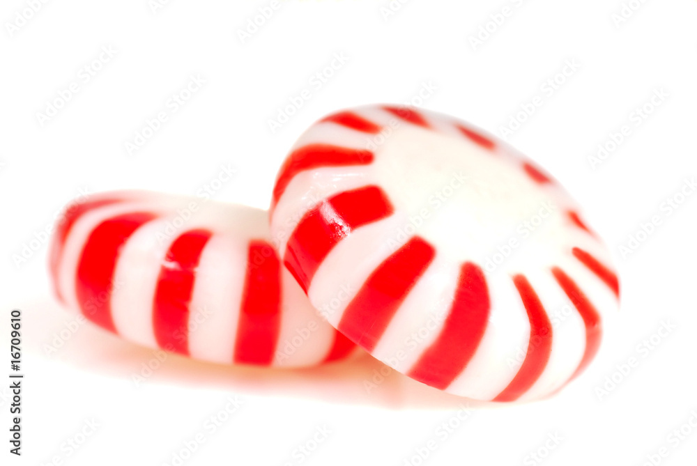 Two pieces of Peppermint Christmas candy Two pieces of Peppermint Christmas candy