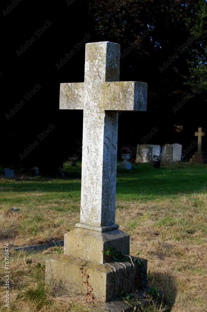 Crucifix gravestone in cemetery