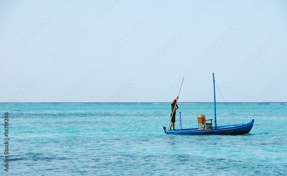 Typical Maldivian boat on blue ocean