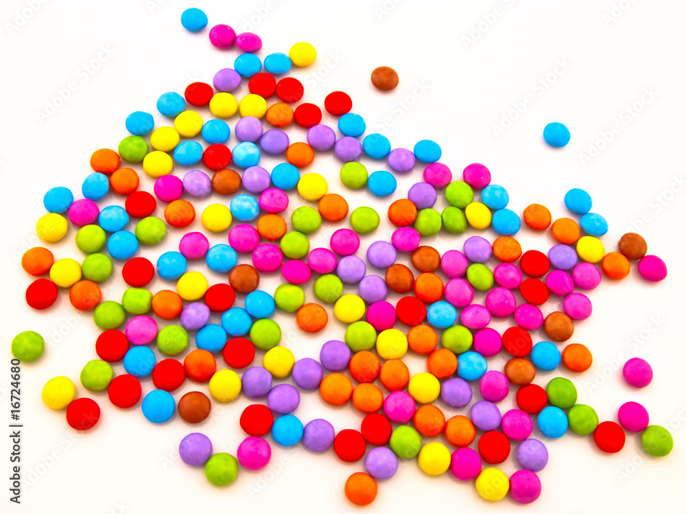Multi-coloured chocolate candy on a white background