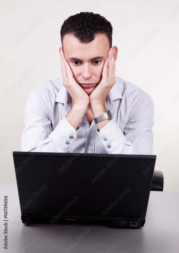 Portrait of stressed young businessman in office Portrait of stressed young businessman in office