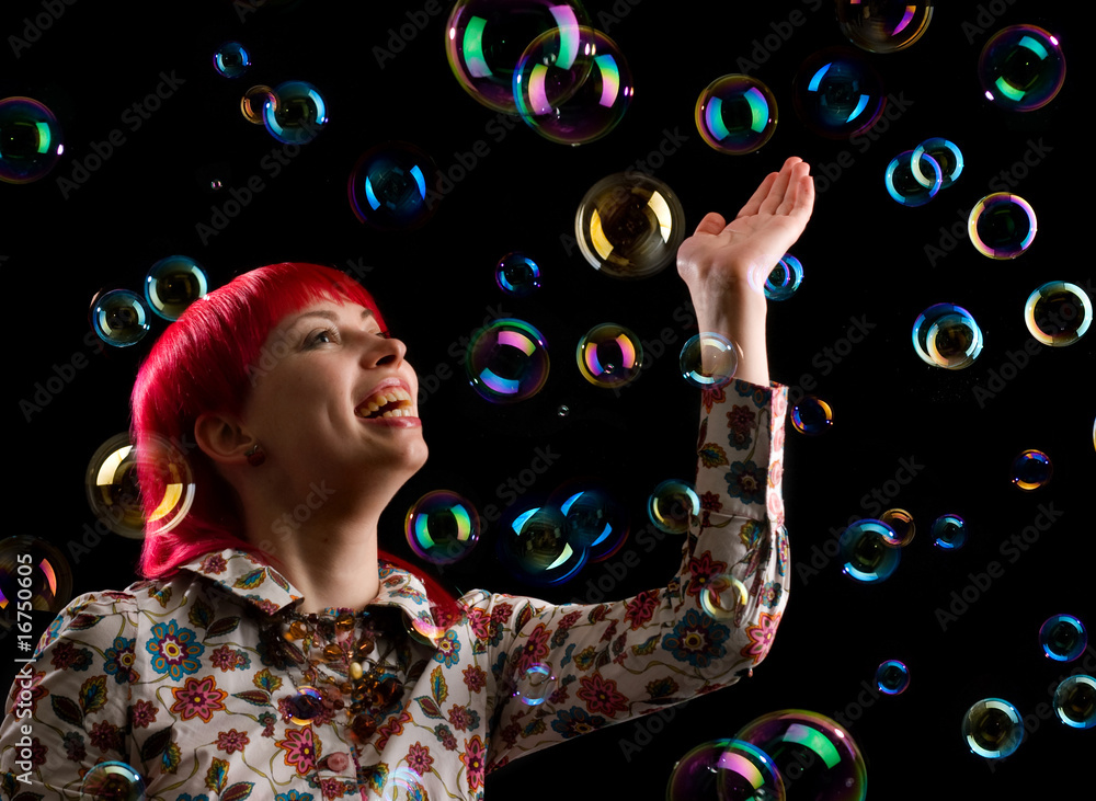 Portrait of a beautiful young woman with soap bubbles Portrait of a beautiful young woman with soap bubbles