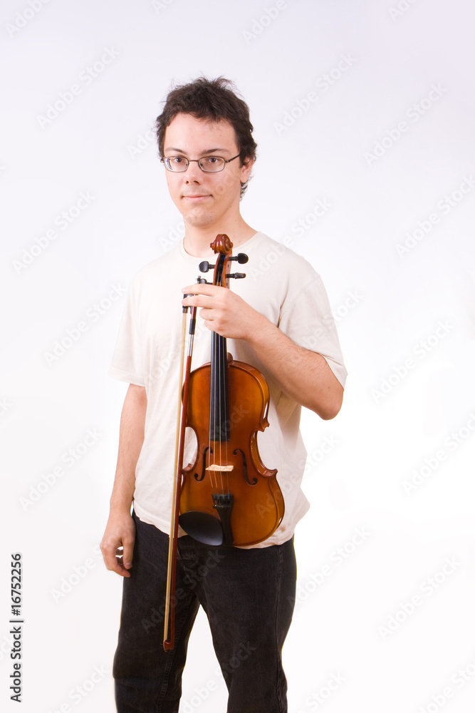 Young man holding a violin and a bow