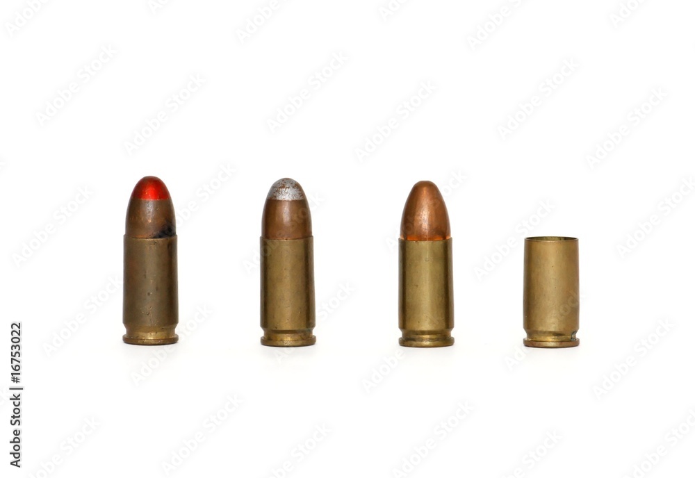 Row of three 9mm Parabellum cartridges and spent case isolated Row of three 9mm Parabellum cartridges and spent case isolated