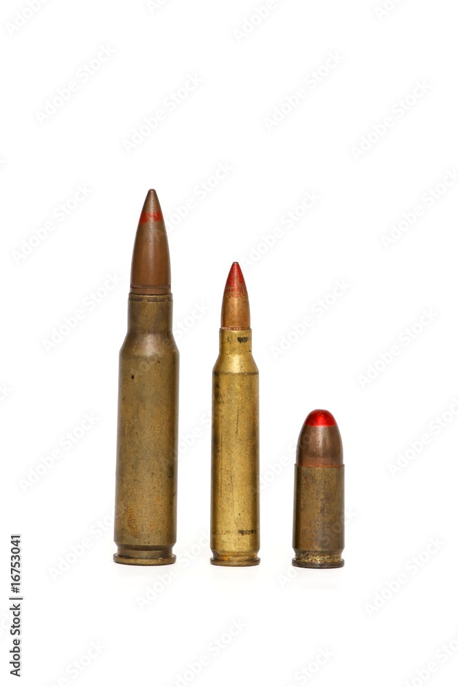 Three red-tipped tracer cartridges of various calibers isolated Three red-tipped tracer cartridges of various calibers isolated