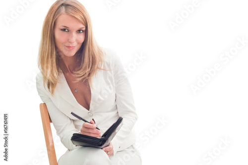 Young beautiful businesswoman making plans, isolated over white