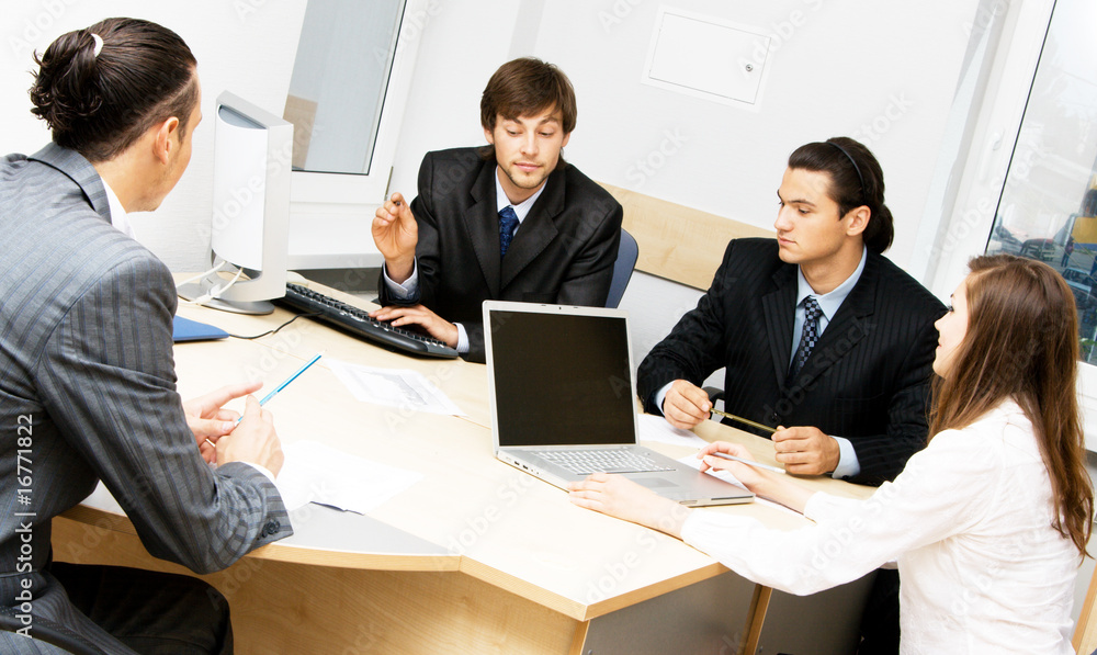 Office workers having a discussion Office workers having a discussion