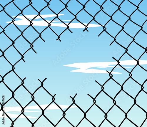 Cut wire fence with blue sky background