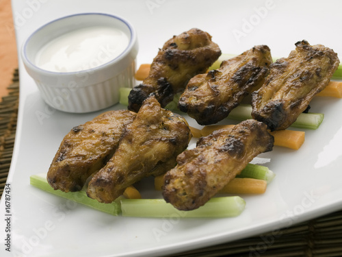 cooked chicken wings on plate photo