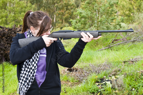 Girl shooting airgun photo