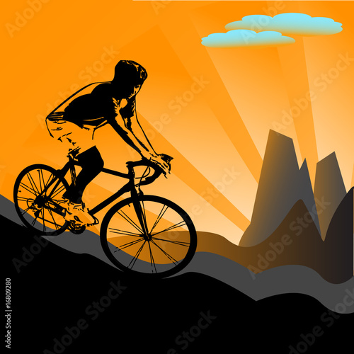 Mountain biker silhouette at sunset