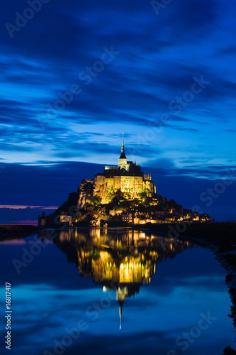 Mont St. Michel reflected in the sea at night