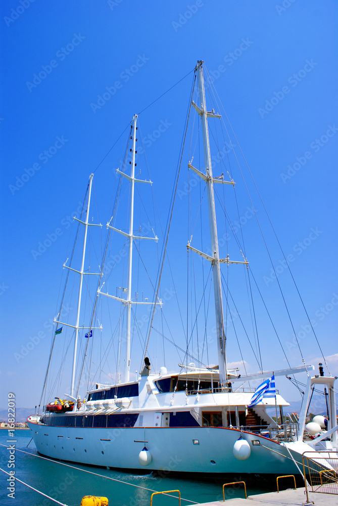 Sailboat sailing in the morning with blue sky