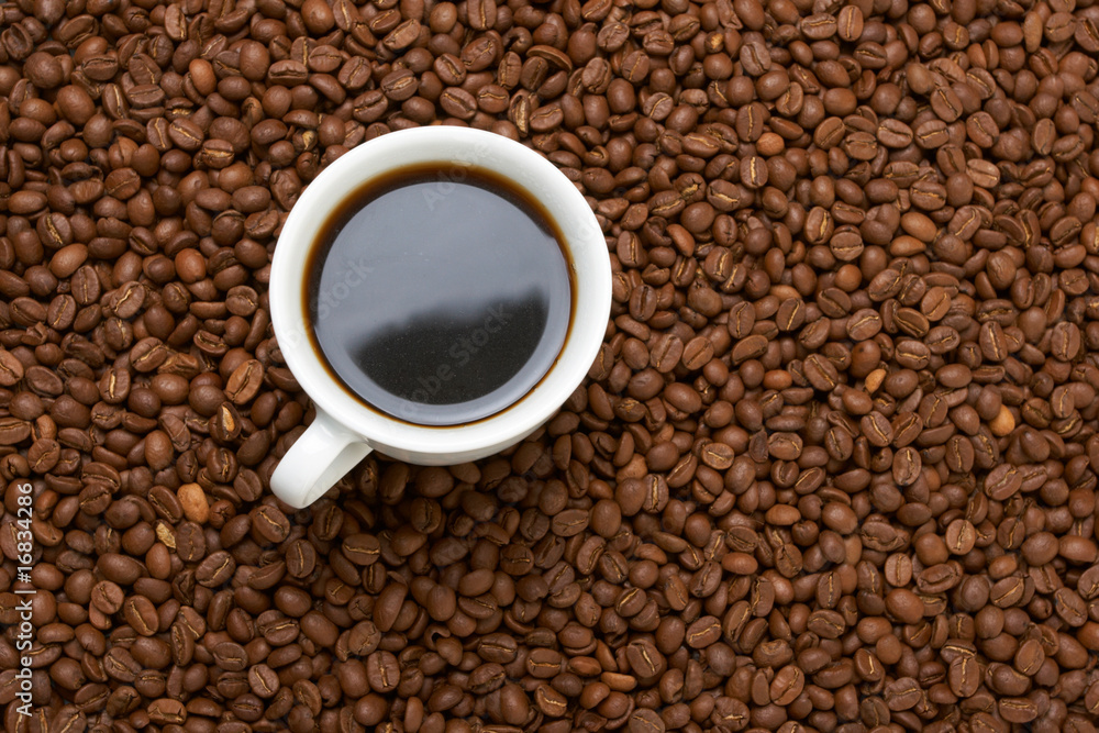 Cup with coffee, costing on coffee grain Cup with coffee, costing on coffee grain