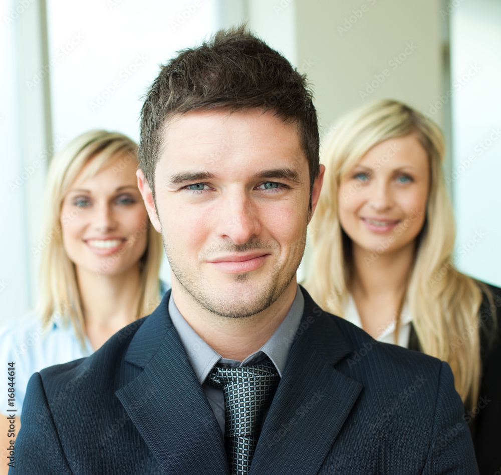 Portrait of a businessman with two businesswomen Portrait of a businessman with two businesswomen