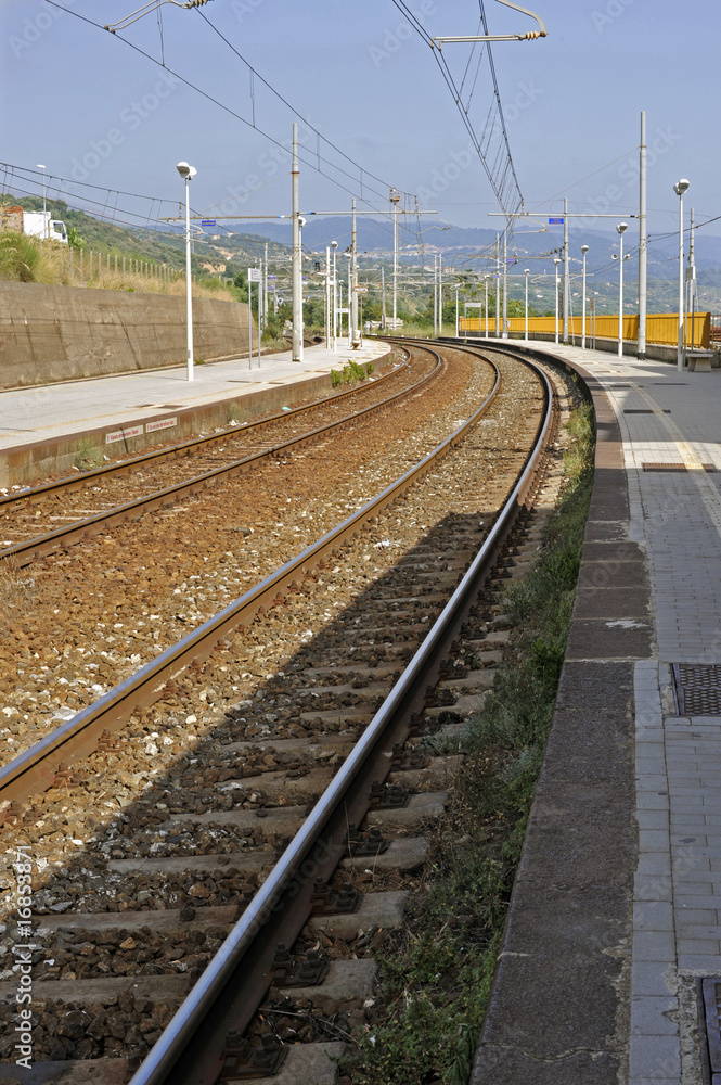 Tracks and electric cables of a small Italian railroad station
