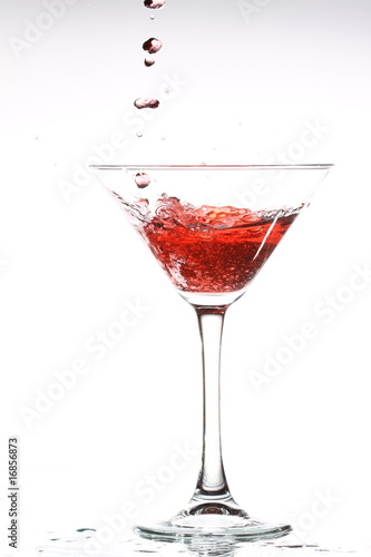 red cocktail on white