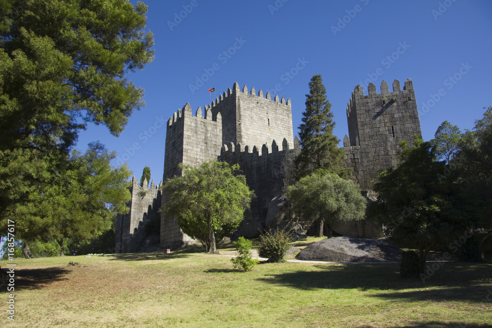 Naklejka premium Guimaraes castle in the north of Portugal and surrounding park
