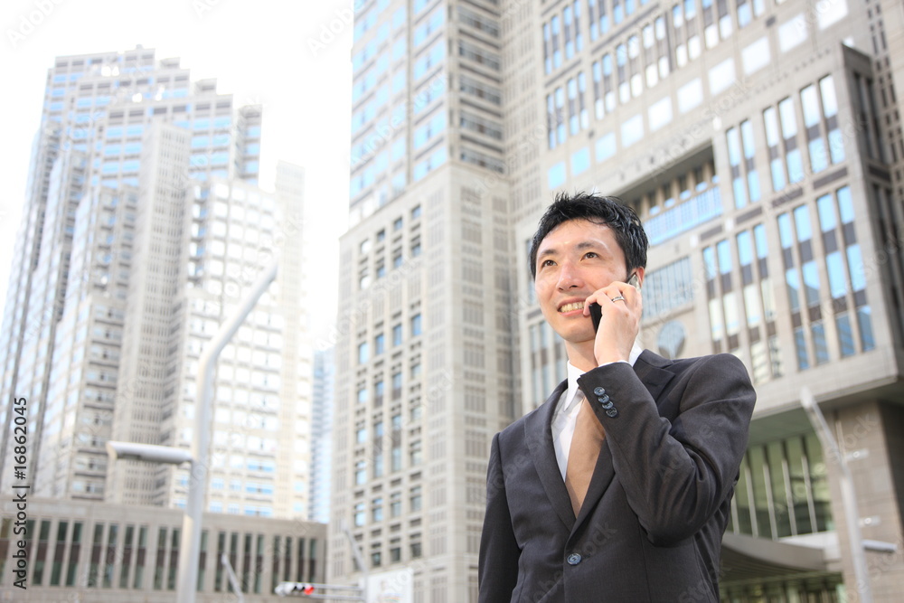 Businessman talks with a cellular phone Businessman talks with a cellular phone