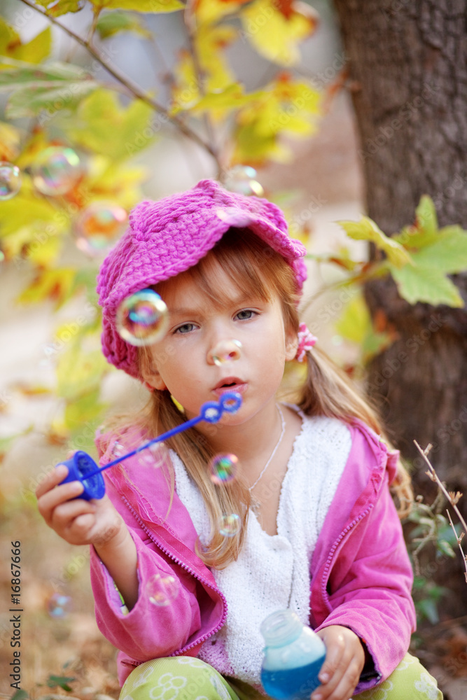 Child blowing bubbles Child blowing bubbles