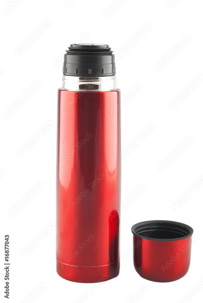 red metal thermos with cup nearby red metal thermos with cup nearby