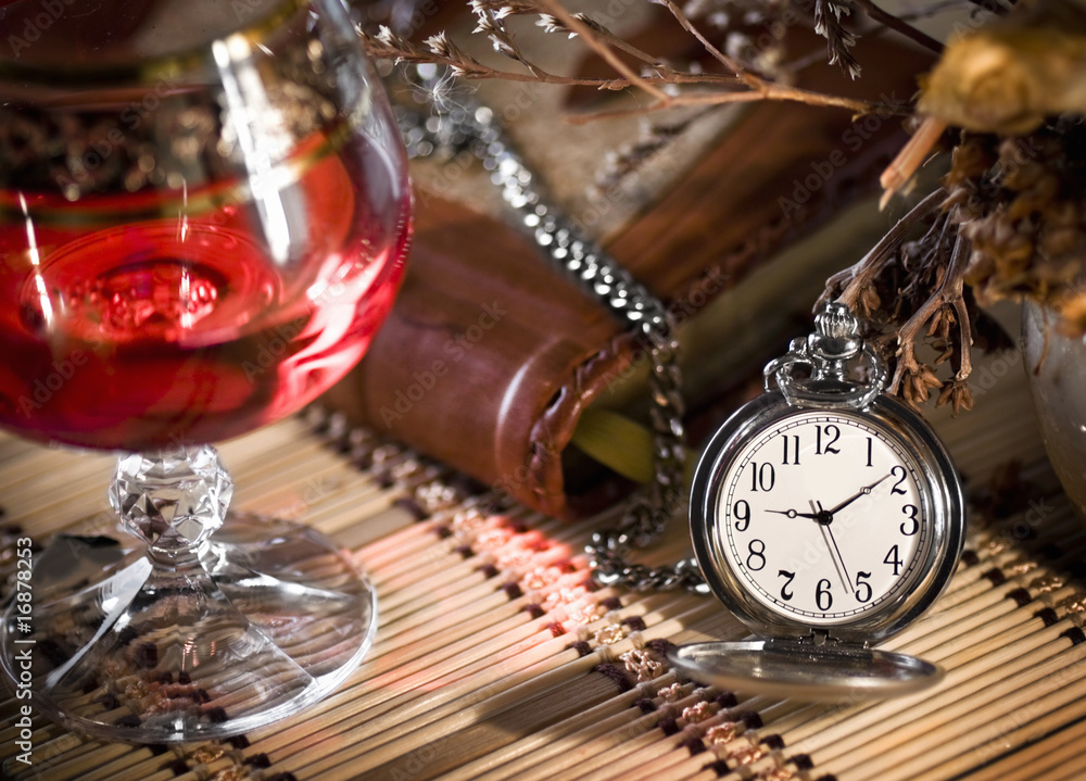 Fototapeta premium the still life with wine glass and pocket watch