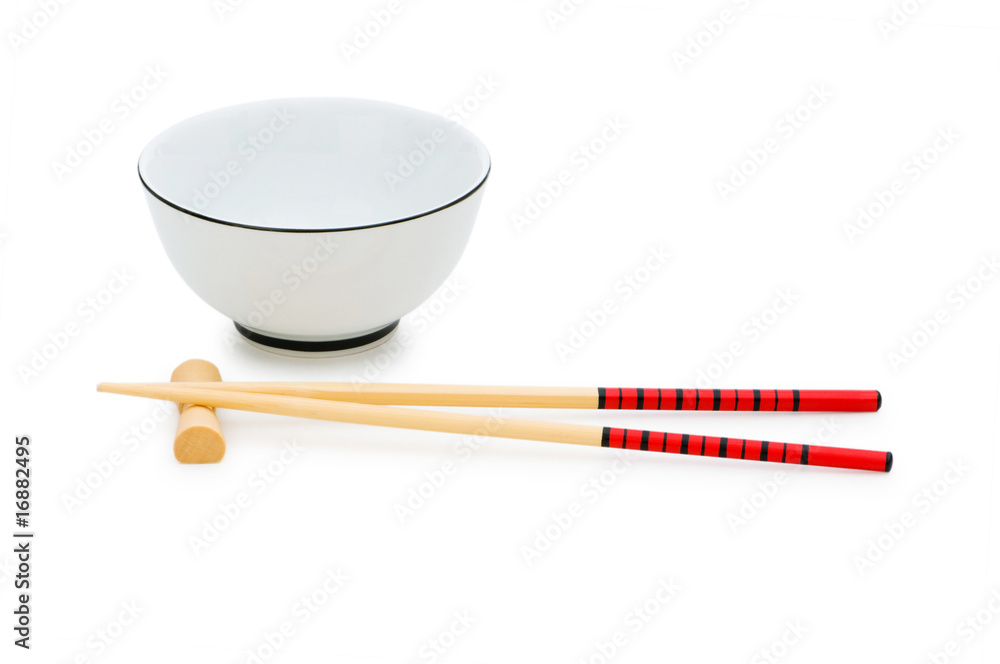 Bowl and chopsticks isolated on the white Bowl and chopsticks isolated on the white