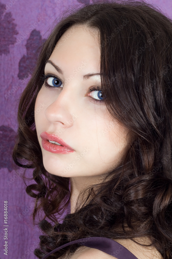Portrait of the pretty girl on a violet background Portrait of the pretty girl on a violet background