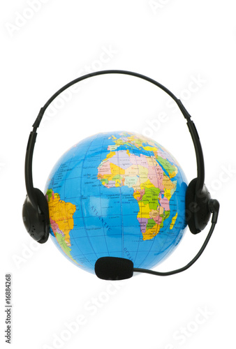 Headset on globe isolated on the white