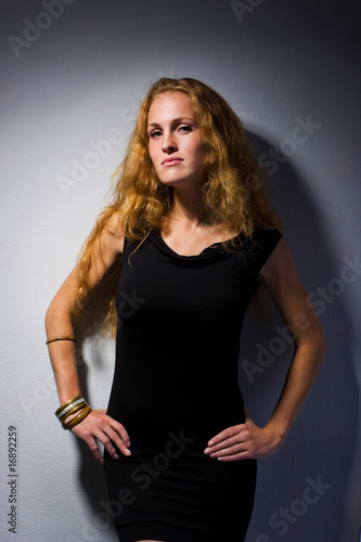 studio portrait of pretty fashionable girl