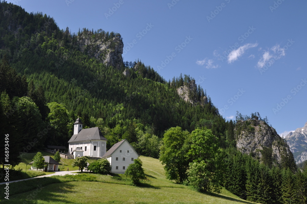 Beautiful alpine scenery with white church