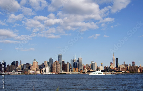capture of nyc over hudson blue sky