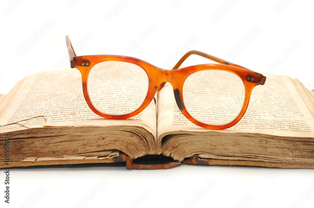 old book and glasses on it