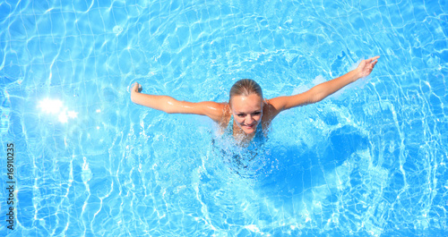 woman enjoying a swimming pool © Netfalls