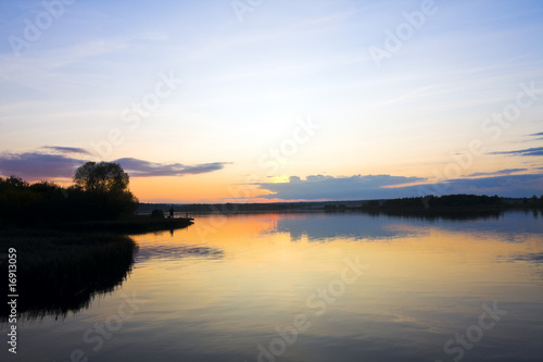 sunset over the lake © OlegDoroshin