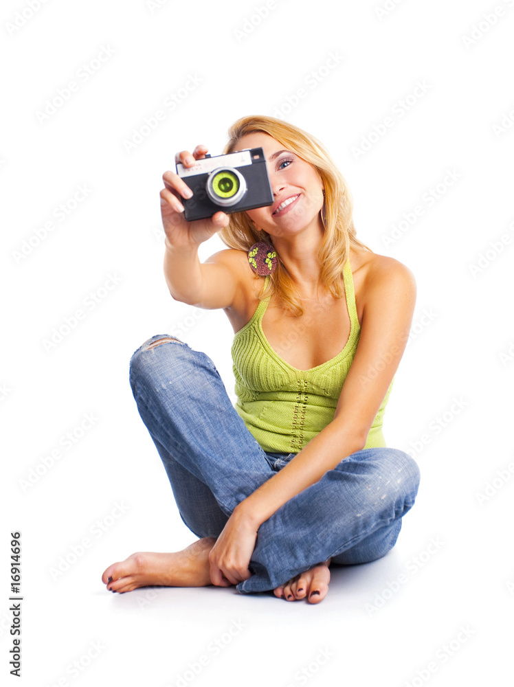 happy young woman sitting on the floor taking a picture happy young woman sitting on the floor taking a picture