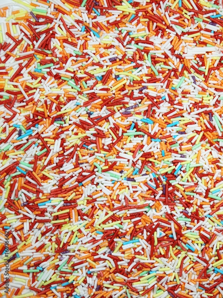 Sweet colored granules background Sweet colored granules background