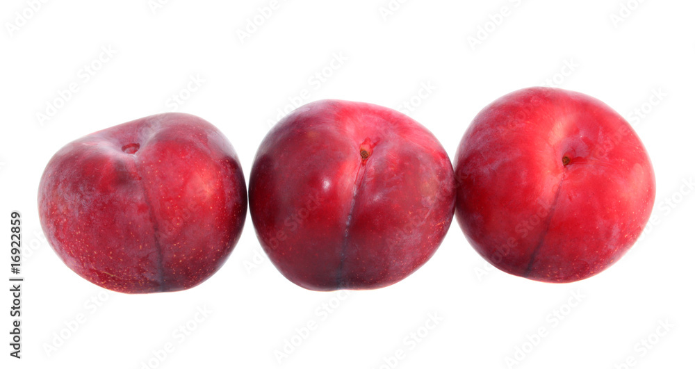 Red large plums isolated. Red large plums isolated.