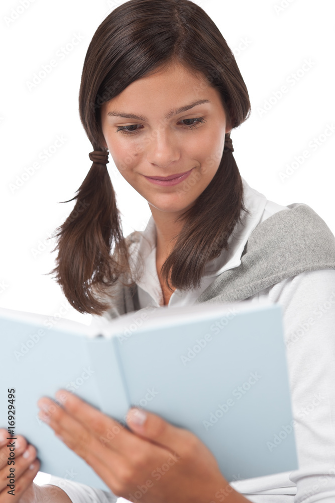 Portrait of teenager reading book
