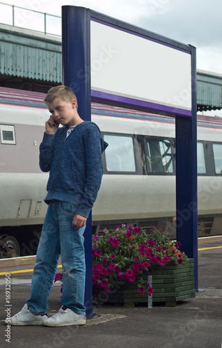 Young boy on mobile phone