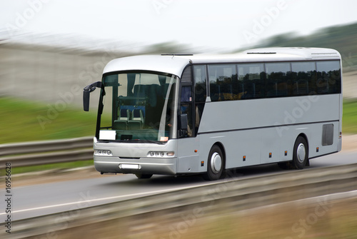 Fast moving tourist bus. Clipping path inside.