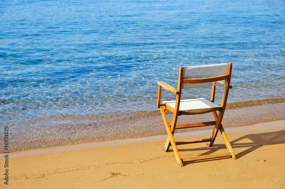 Chair on a golden sandy beach