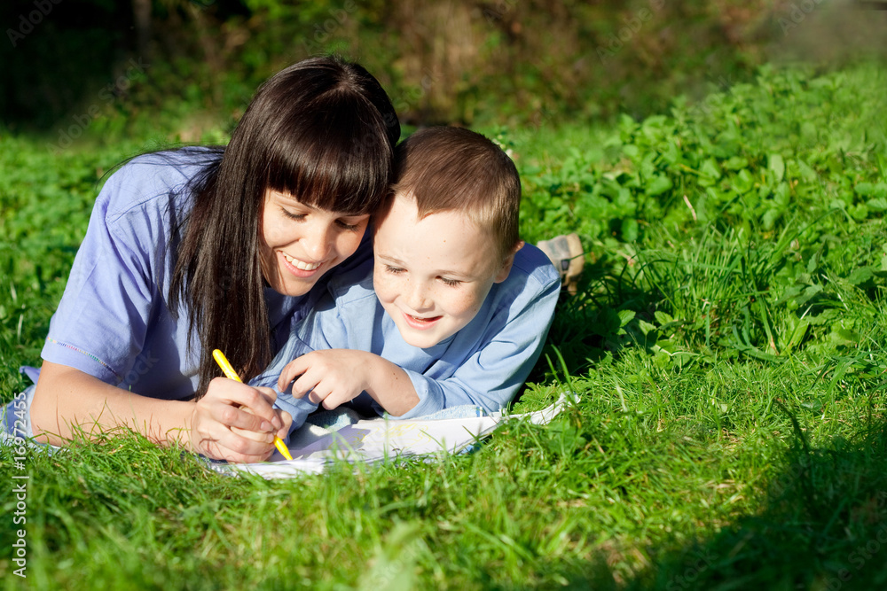 Mother and son enjoying his writing Mother and son enjoying his writing