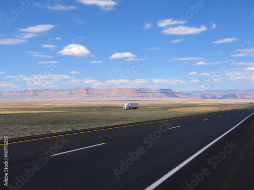 truck along the highway in the american desert