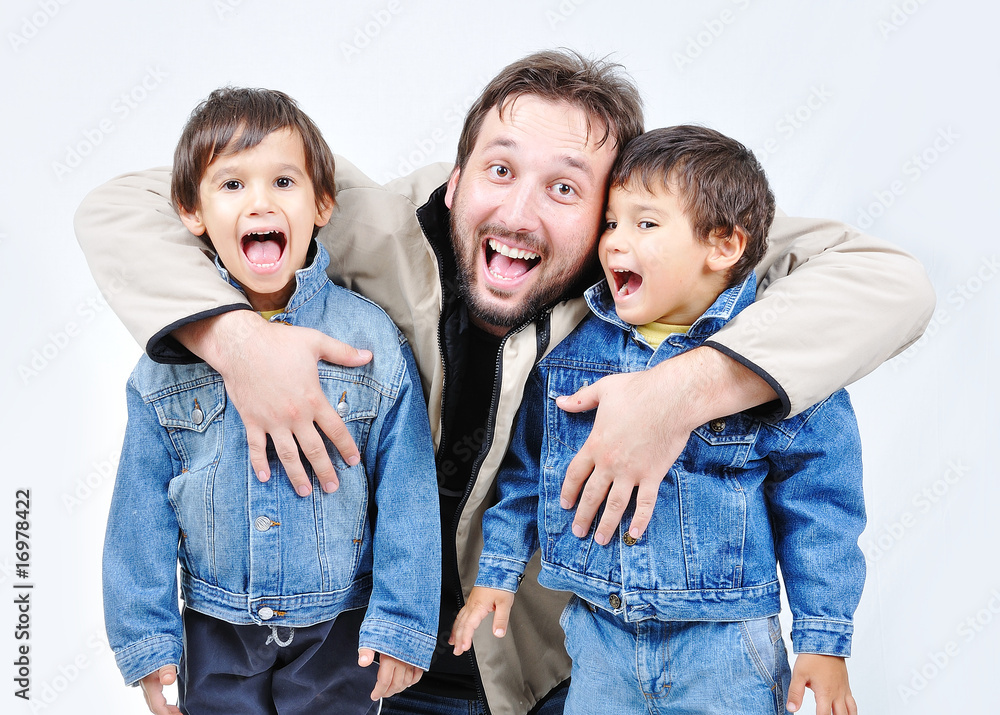 Father and two boys in fall clothes