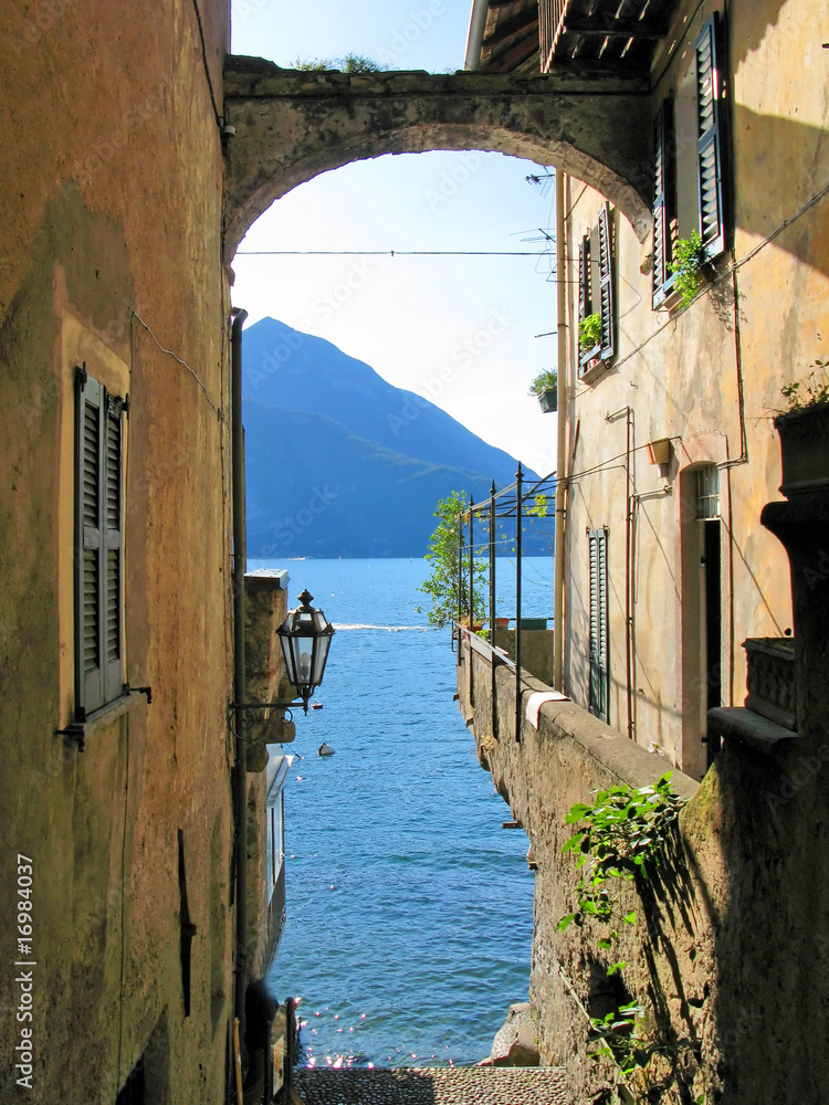 Romantic view to the famous Italian lake Como from Varenna town - obrazy, fototapety, plakaty 