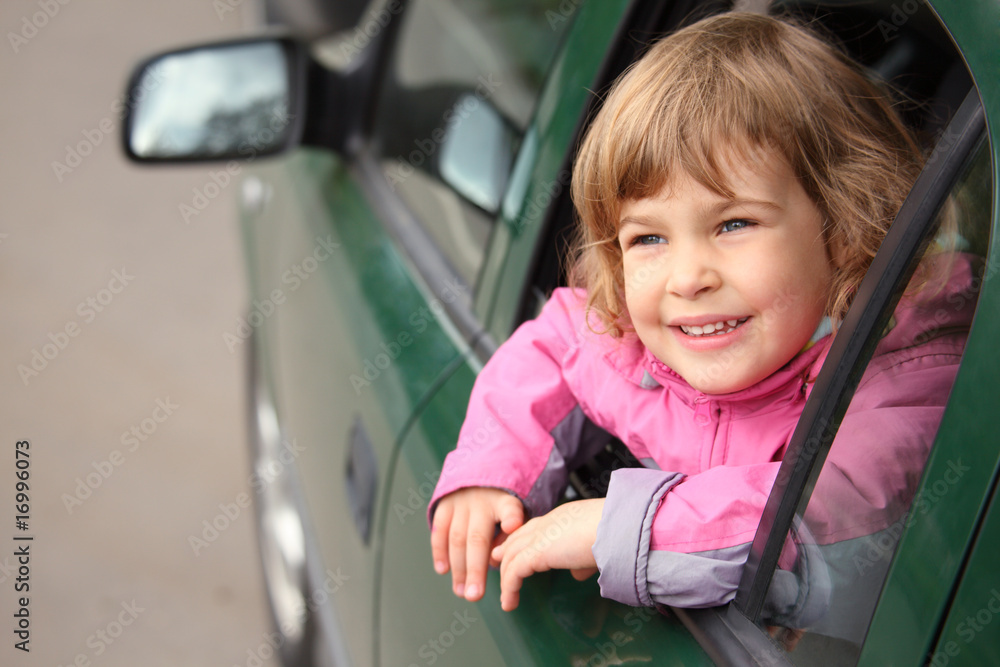 girl in the car looking throw window girl in the car looking throw window