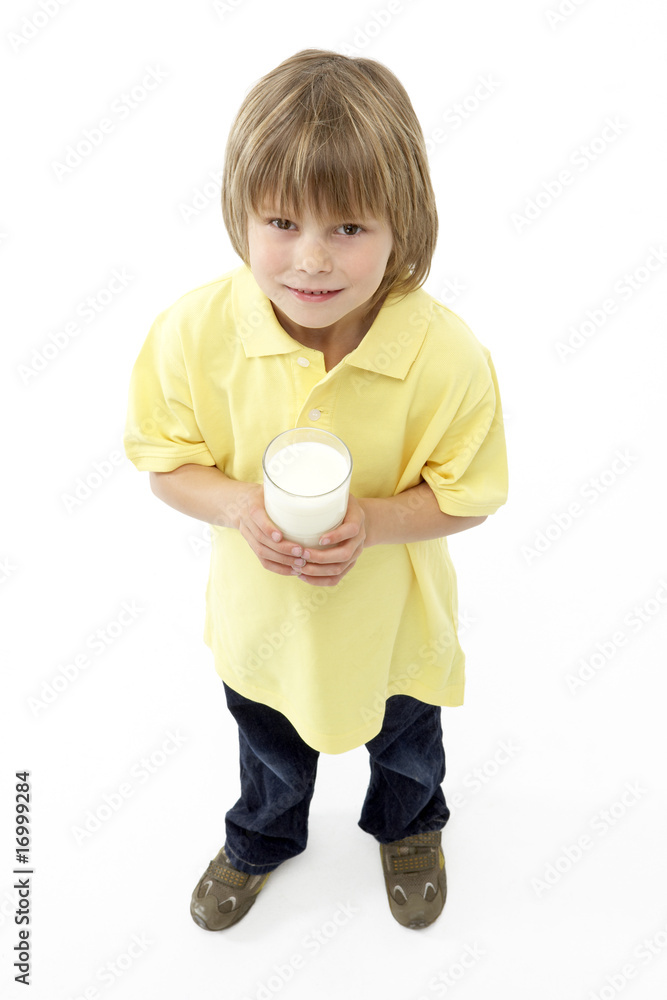 Studio Portrait of Smiling Boy Holding Glass of Milk Studio Portrait of Smiling Boy Holding Glass of Milk