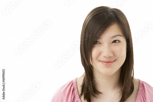 Studio Portrait of Smiling Teenage Girl © Monkey Business